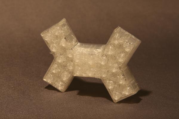 A 3 pointed lego brick from thingiverse.