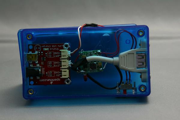 The assembled box showing charger, regulator, USB connector and the flush-mounted power switch.